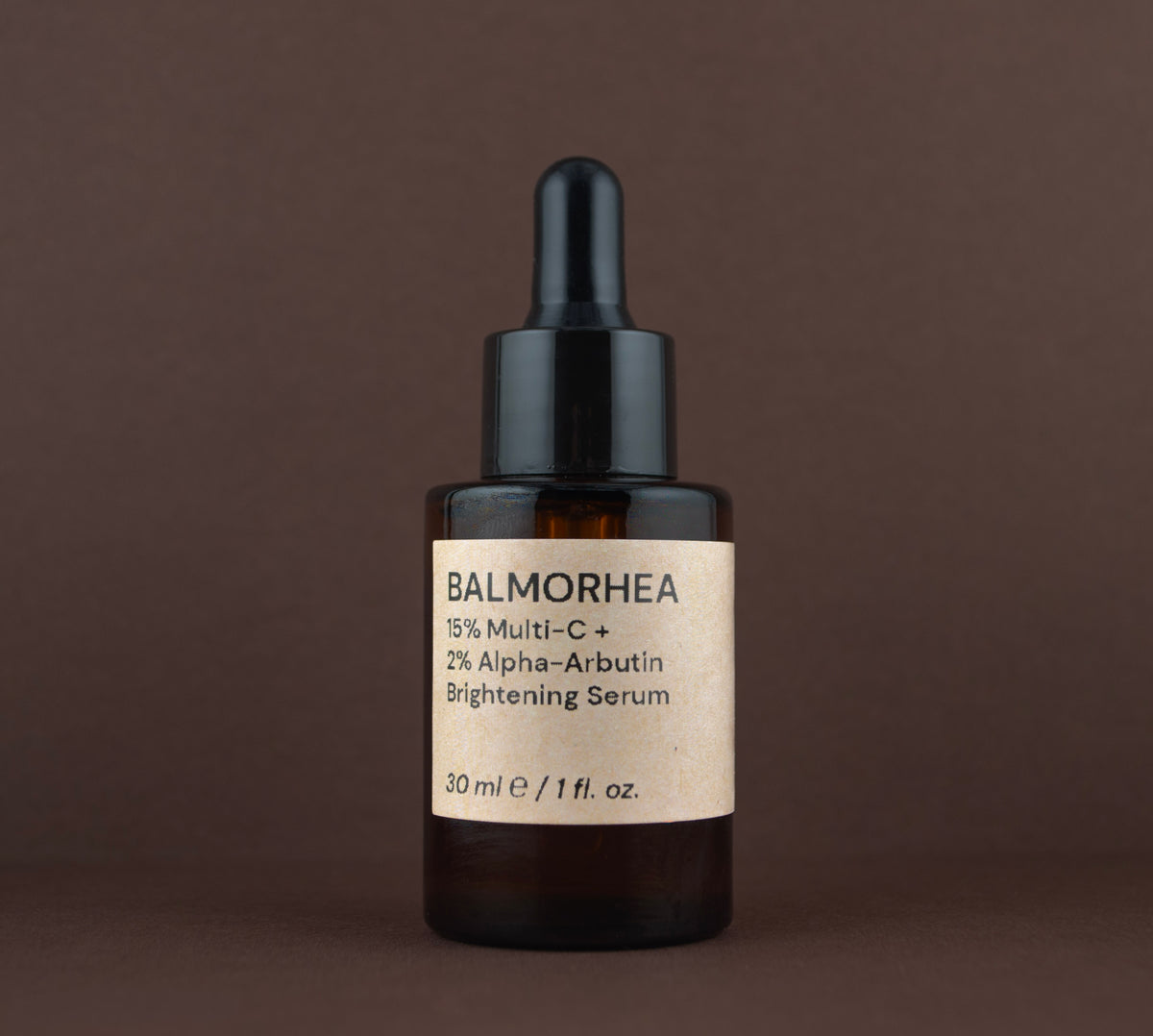 Front view of Balmorhea 15% Multi-C + 2% Alpha-Arbutin Brightening Serum (30 ml / 1 fl. oz.) in an amber glass dropper bottle.