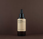 Front view of Brooks 2.5% AHA Resurfacing Treatment (50 ml / 1.7 fl. oz.) in an amber glass dropper bottle.