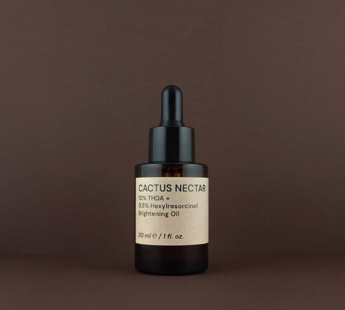 Front view of Cactus Nectar 10% THDA Brightening Oil (30 ml / 1 fl. oz.) in an amber glass dropper bottle.