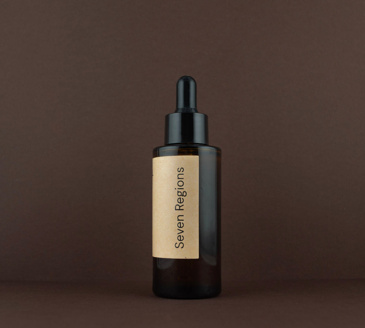 Side view of the Seven Regions Llano Renewal 10% Urea softening treatment amber glass bottle.