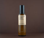 Front view of Lotus Flower & Honey Conditioning Cream Cleanser (100 ml / 3.4 fl. oz.) in an amber glass pump bottle.